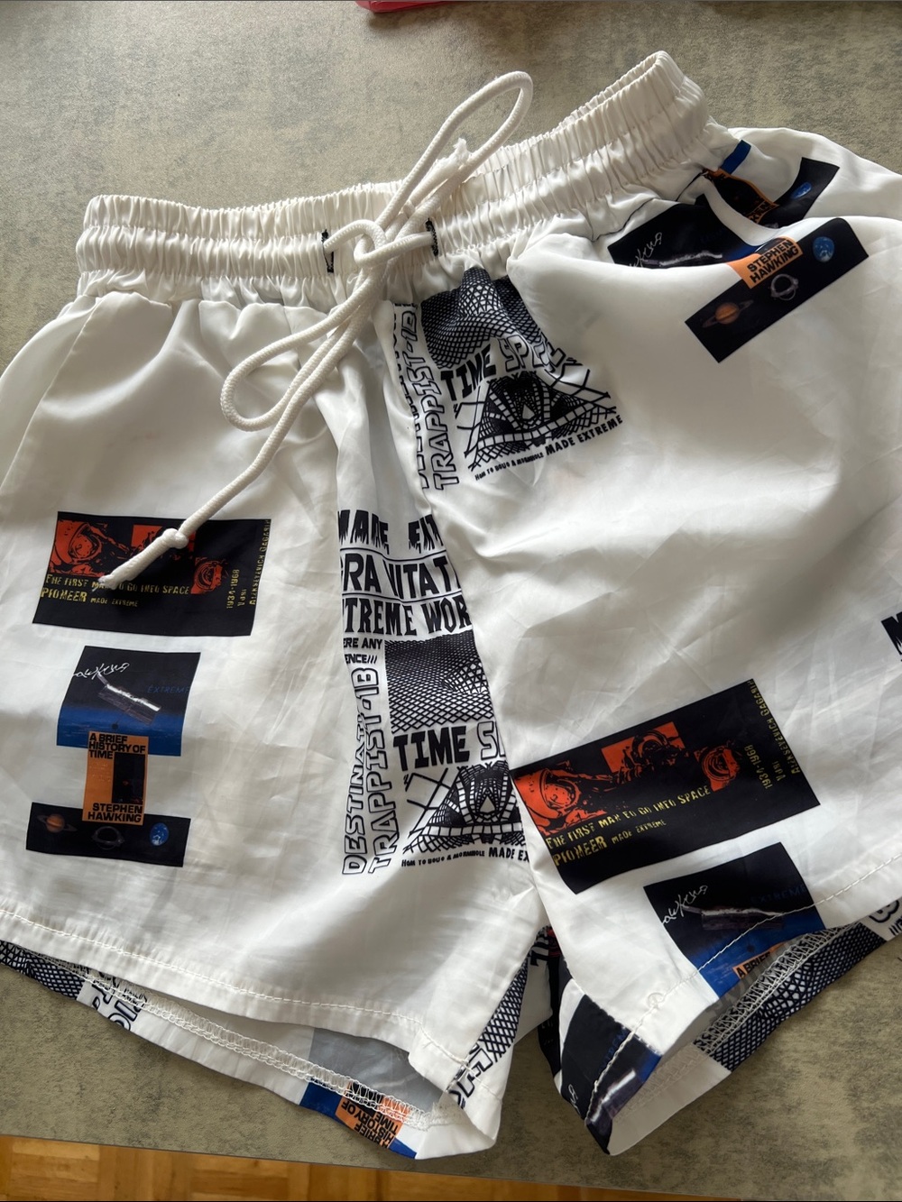 White Graphic Swim Shorts with Black & Orange Accents